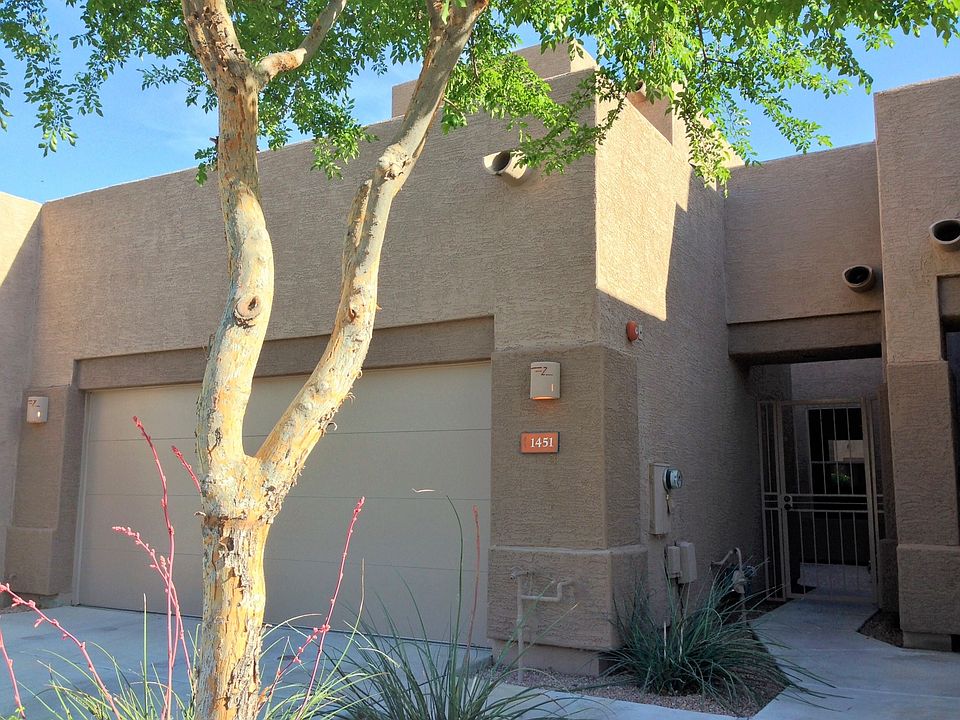 Gate to front entry courtyard / Two car garage
