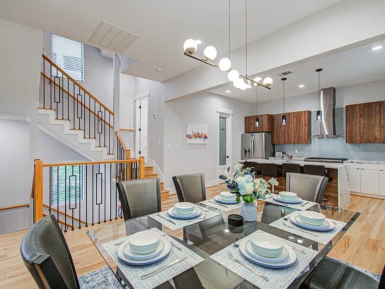 The dining area is thoughtfully equipped with everything you need to enjoy meals and relax with family after a busy day.