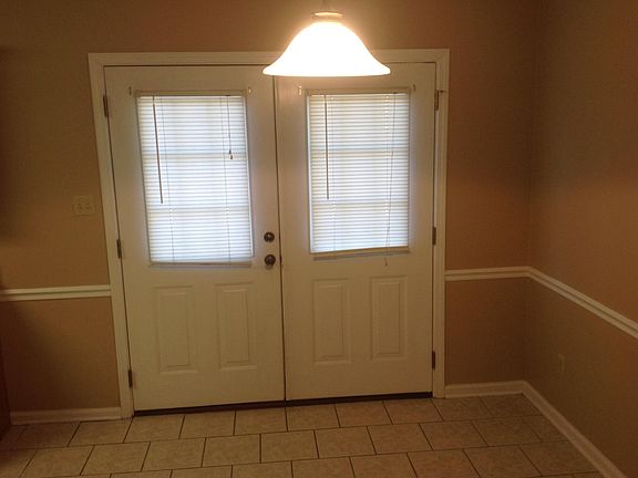 Double french doors leading to rear deck