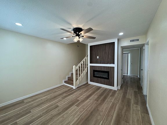 living room with built in fire place and mantel