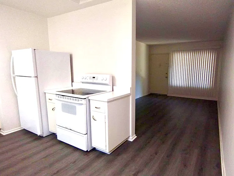 Kitchen, facing southeast, and living room.