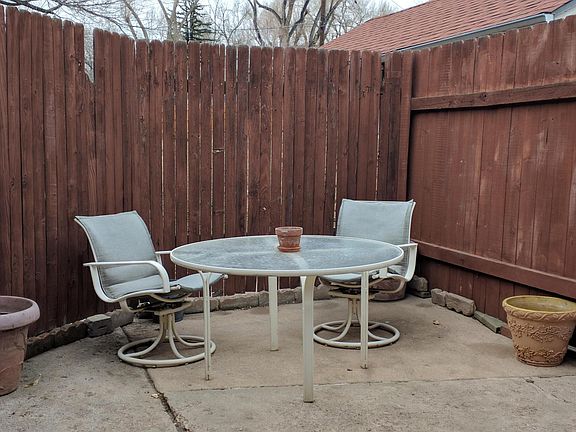 Your private patio, with included table and chairs (and flower pots).