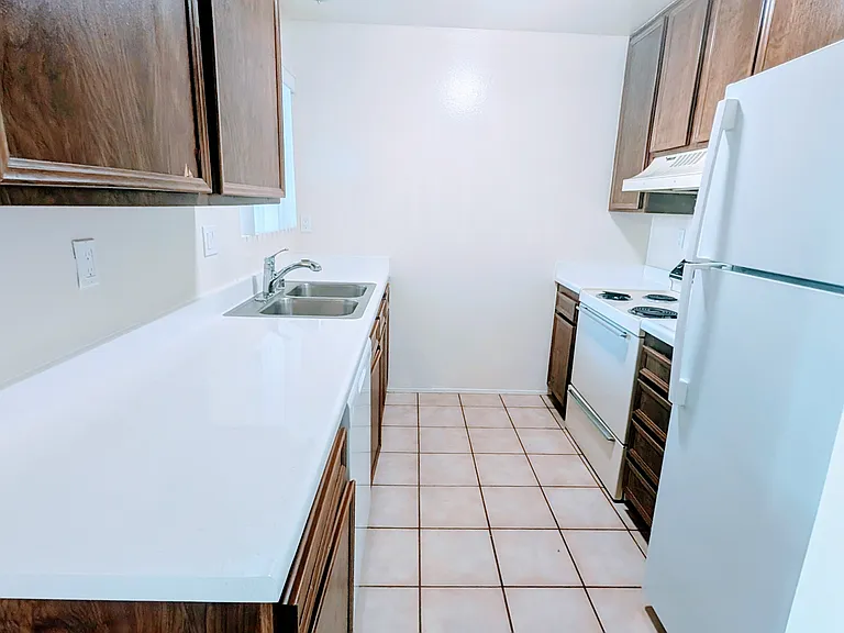 Spacious kitchen with ample storage.