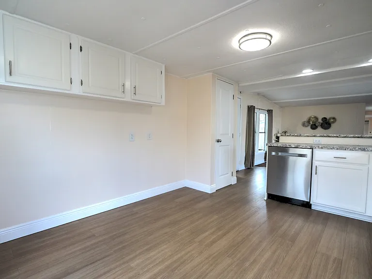 Included (but not shown in photo) is a stainless steel refrigerator/freezer between the upper cabinets and the pantry.