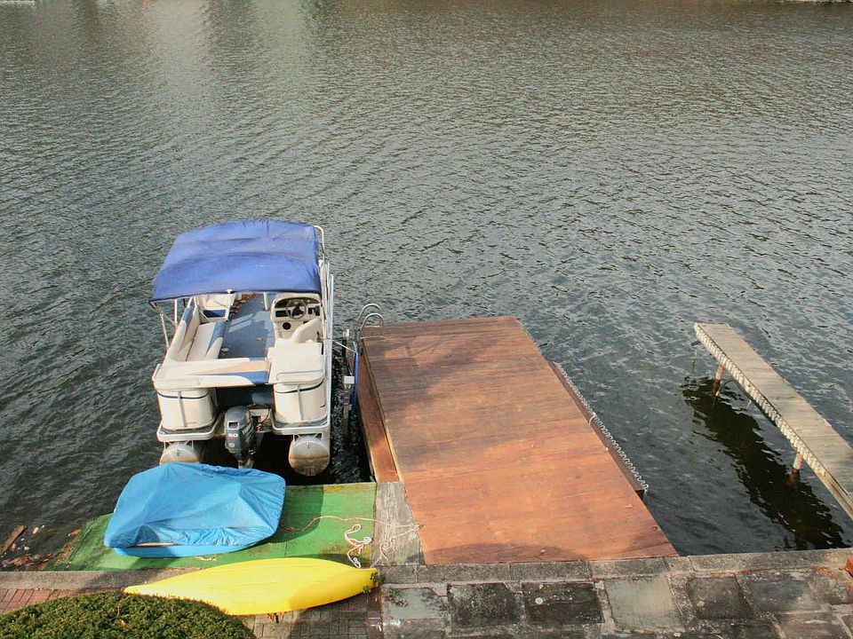 More than 100' feet of frontage and 50' of lake side patio.