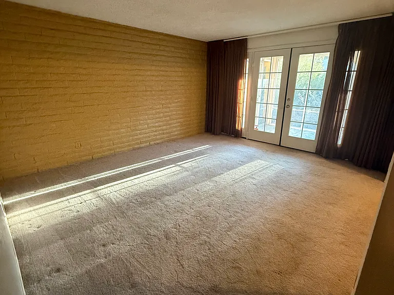 Living room area opens into the AZ room with french doors.