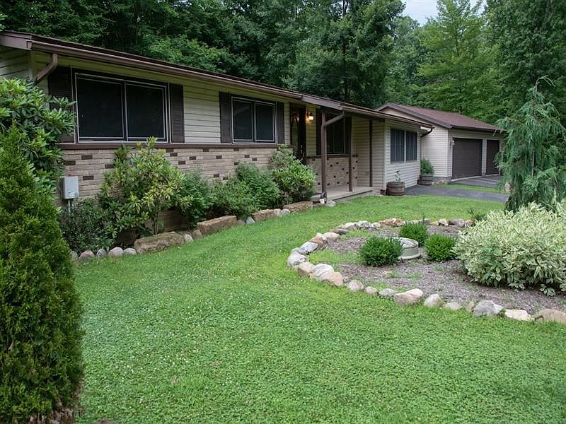 Deceiving ranch home on 3 wooded lots!