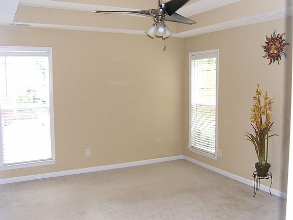 Roomy Main bedroom with tray ceiling