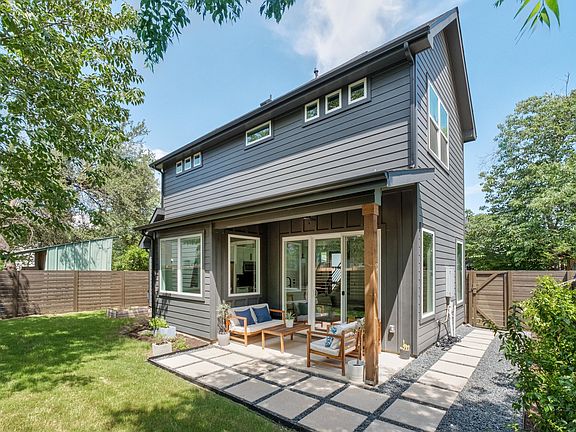 Covered patio with professional landscaping.