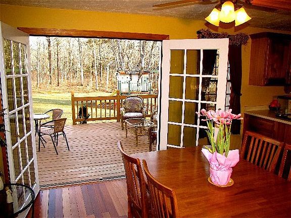Dining room open to sunn deck and private yard