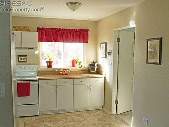 Part of kitchen, door going into laundry room