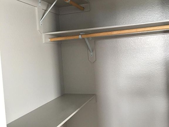 master bedroom walk-in closet (partial view)