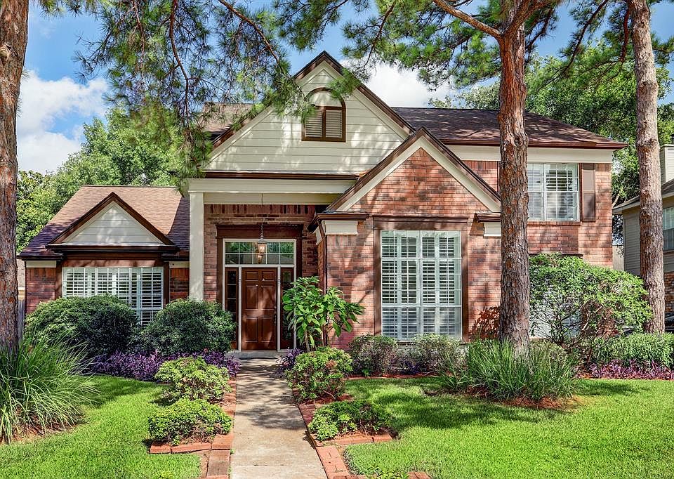 Beautiful exterior with plantation shutters across the front of the home!