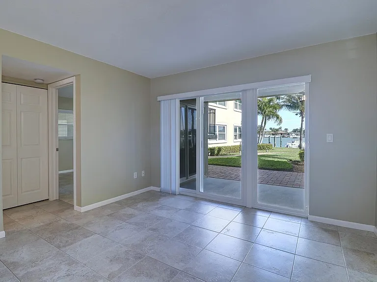 Glass doors open to a private extended waterfront patio