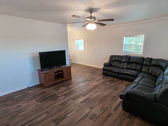 Living room and opening to dining room.