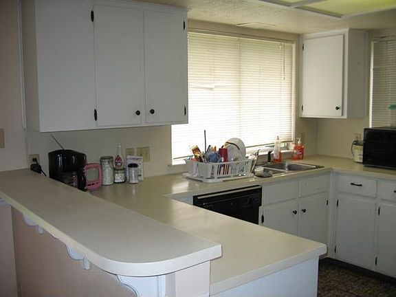Light and airy kitchen with breakfast bar.