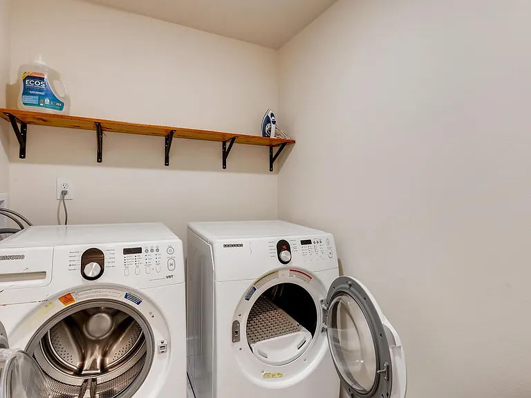 Laundry Room with Iron and Ironing Board. Guests have full access
