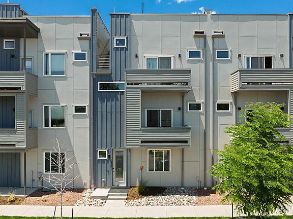 Front of house. It has two private balconies. One on the living room level and the other attached to the master bedroom.