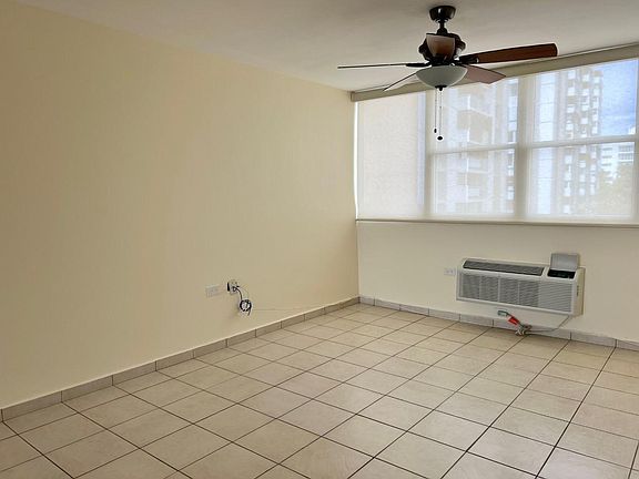 Family Room with Window Treatments and High Efficiency AC