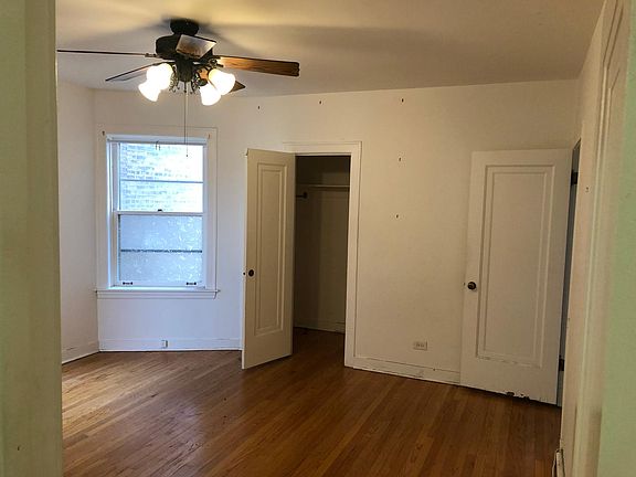 master bedroom with walk-in closet