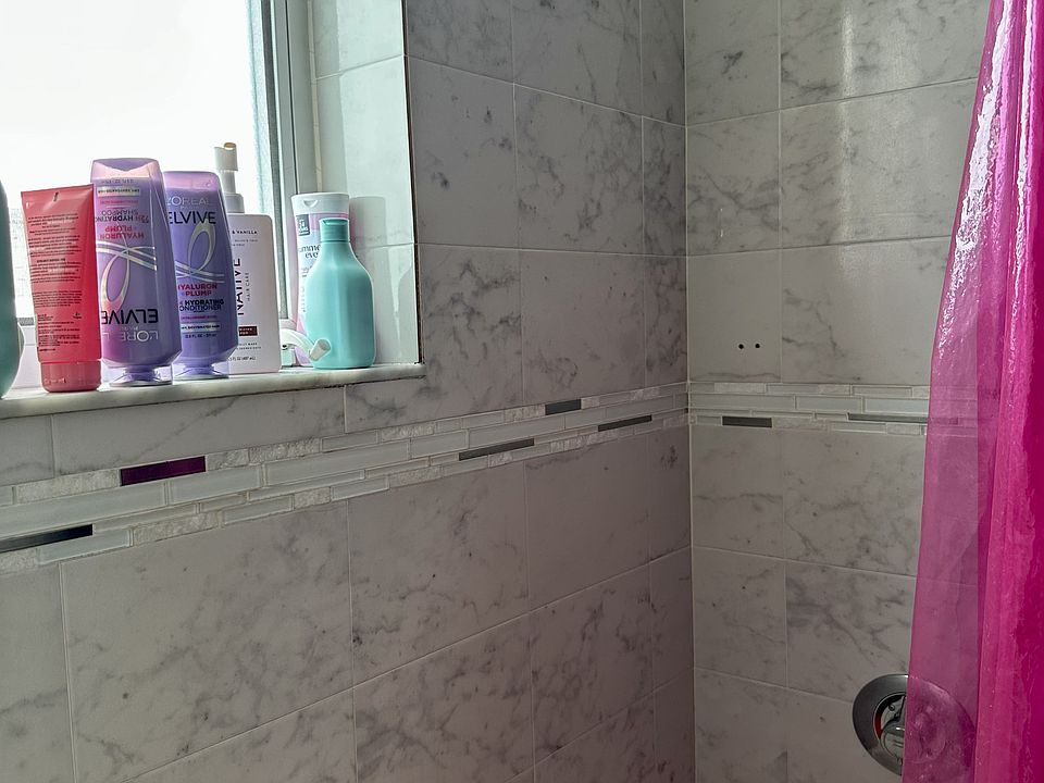 second floor full bathroom with tub