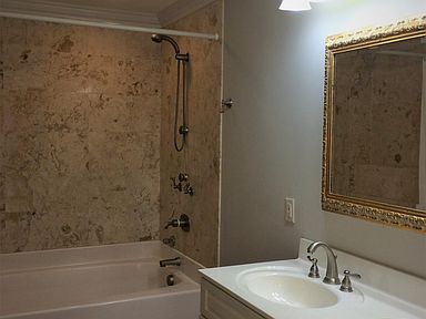 Oversized 6 ft soaker tub with body jets and hand held shower spray. large linen closet.