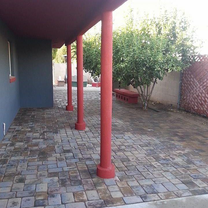 Lemon trees, pavers, relaxing space.