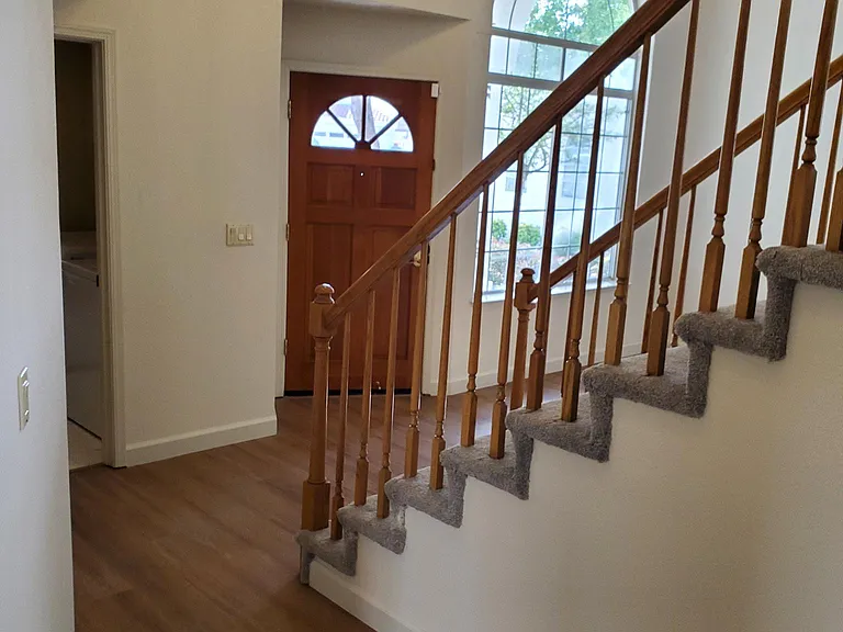downstairs hallway looking from family room to front door.