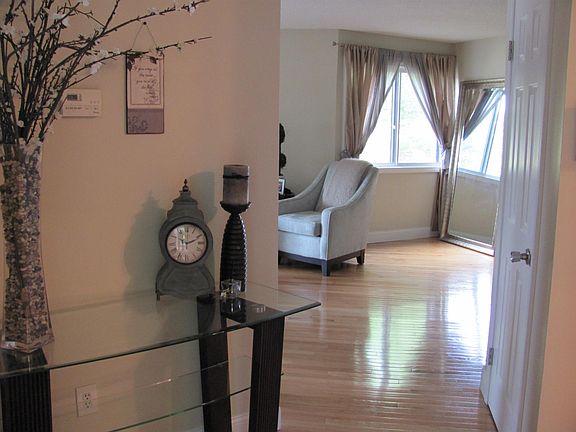 ENTRANCE FOYER LEADING TO LIVING ROOM