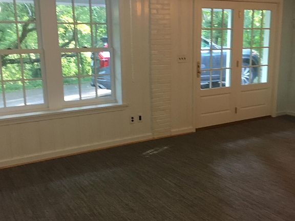 French doors in walk out basement to driveway parking.