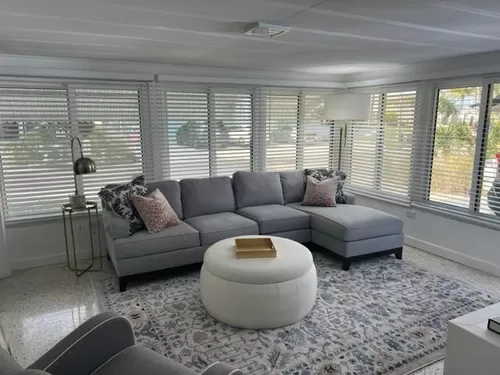 This is the entry living room off the carport. Ethan Allen sofa and airy natural light. Large screen SMART TV, - 18319 Sunset Blvd