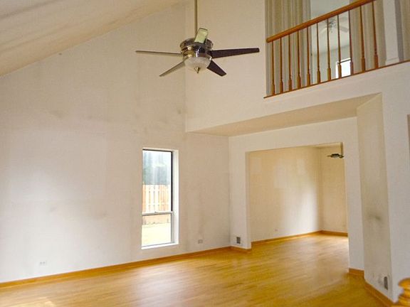 Spacious Living Room with Open Floor Plan and Hardwood Floors