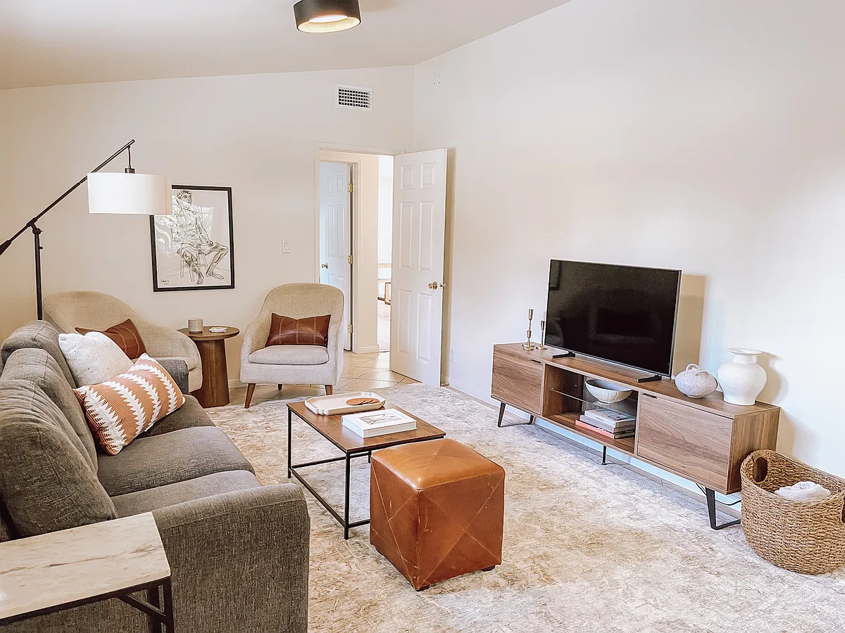 Furnished Living room (couch also folds out to Queen bed so it can operate as a closable guest/bonus room). - 1049 La Vista Rd
