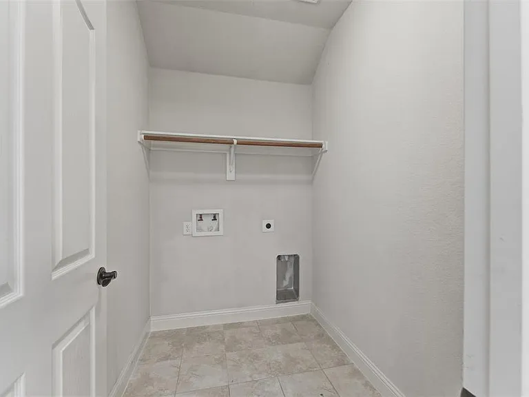 Spare room with lofted ceiling and carpet flooring