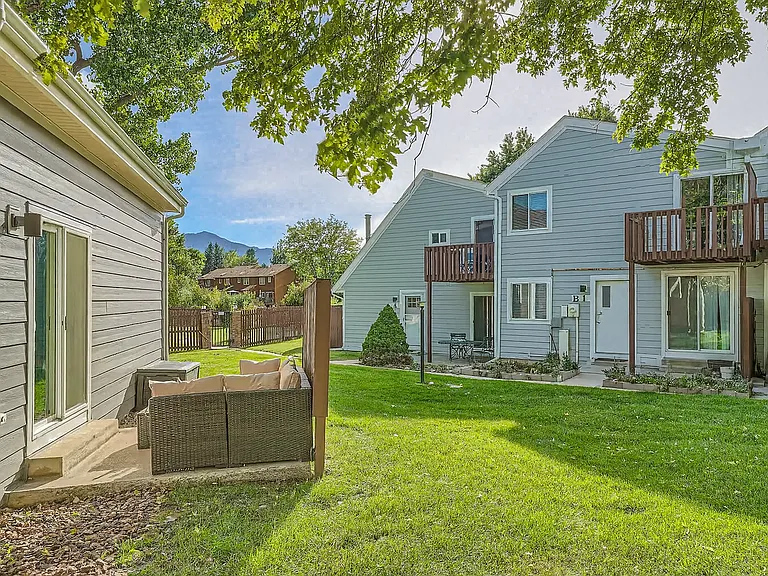 Spacious shared yard with mountain views and shady trees _ perfect for morning coffee or afternoon lounging.