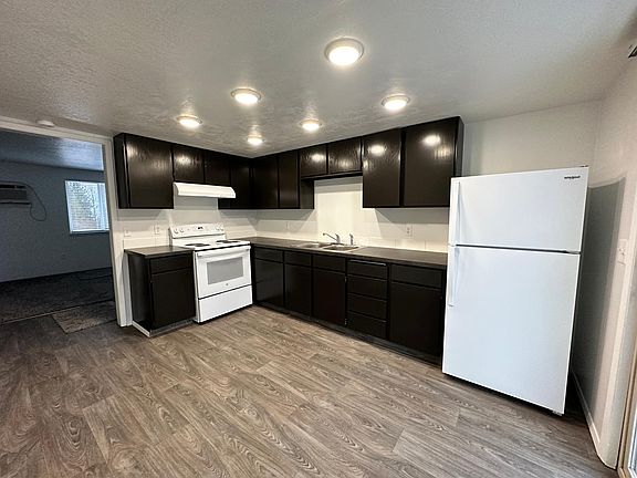 Newly remodeled kitchen with brand new appliances. Sliding glass door to outside barbecue deck.