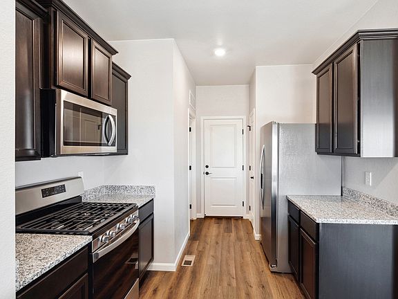 Chef-ready kitchen with stainless appliances and granite countertops.