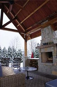 Beautiful outdoor living area  timber frame porch  locally milled (renovated in 2013), outdoor granite, stamped concrete, gas fireplace (2013) living room.