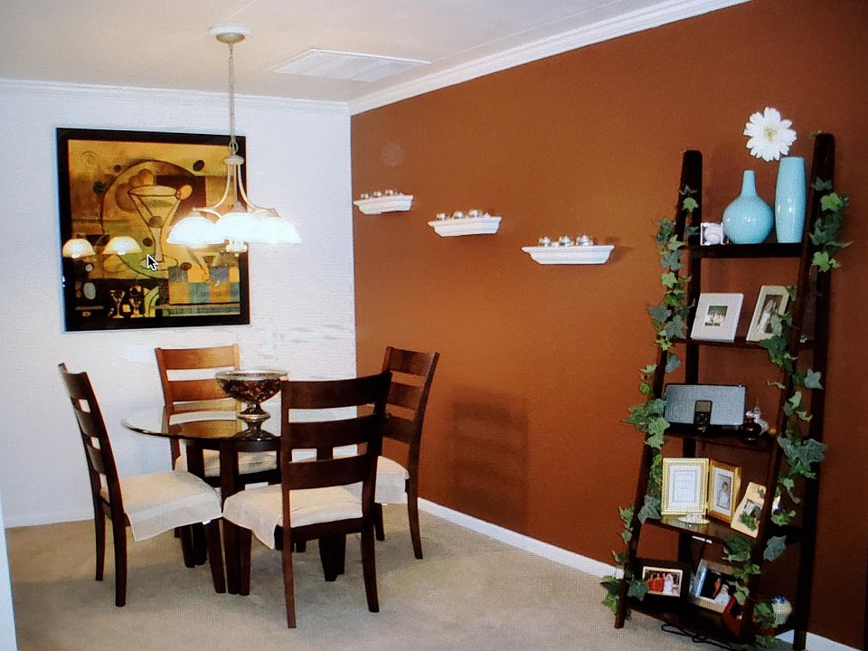With furniture. Update with hardwood floors and white walls as shown in other picture.