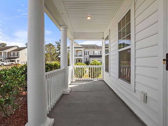 Comfy front porch with ample room for lounging