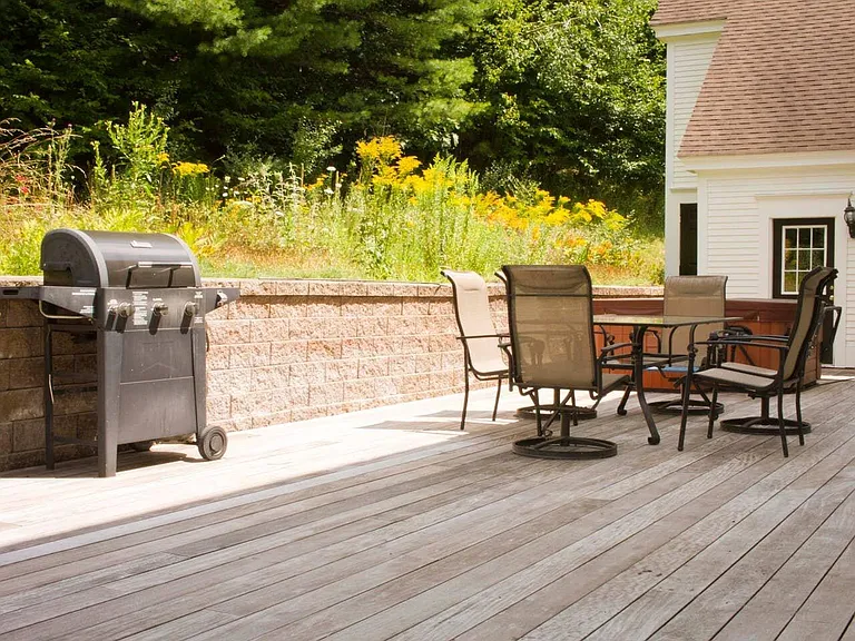 Outdoor back deck with BBQ and patio table