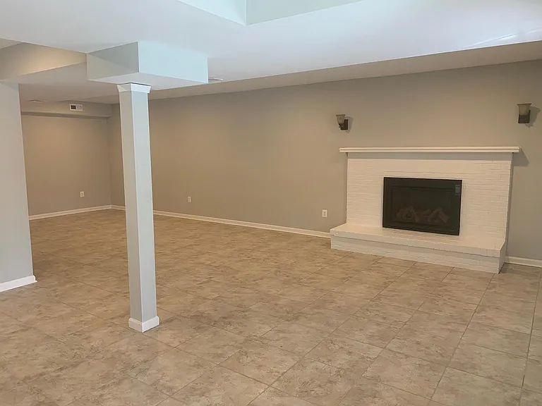 Basement - Recreation Room. Wired to hang Big TV on wall, Gas Fireplace, Adjacent Wet Bar.
