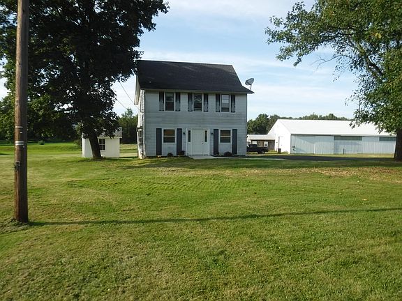 LOOKING AT THE HOUSE FROM TRUMBUAERSVILLE ROAD