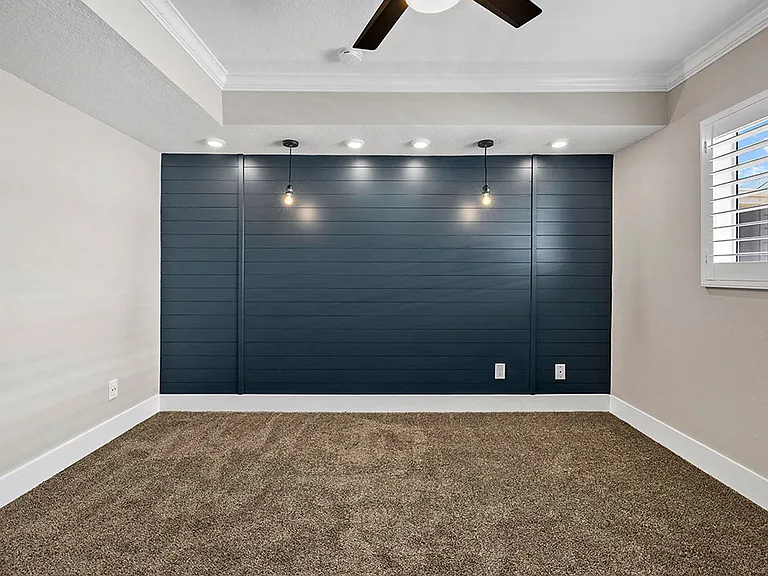 Designer shiplap on bedroom accent wall.
