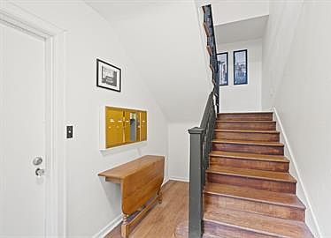Honey-toned hardwood flooring runs throughout.