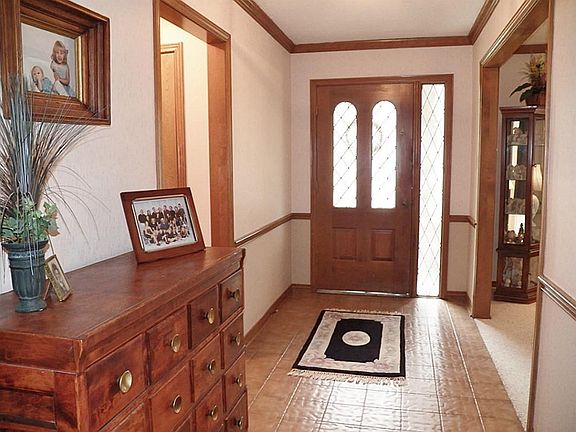 Entry hall. Formal living is on the right, hallway to study/nursery on left.
