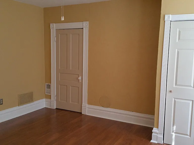 Larger bedroom - second view toward smaller closet.