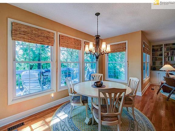 ENJOY EATING IN THE SUNNY BREAKFAST AREA LOOKING OUT TO THE TREED BACKYARD