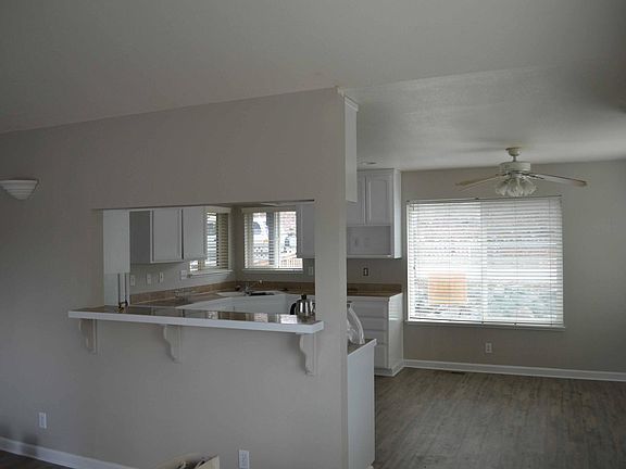From the living room the bar available and looking into the kitchen.