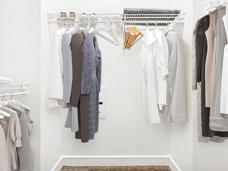 Explore the elegance of this spacious walk-in closet, perfect for your wardrobe essentials. Explore the elegance of this spacious walk-in closet, perfect for your wardrobe essentials.